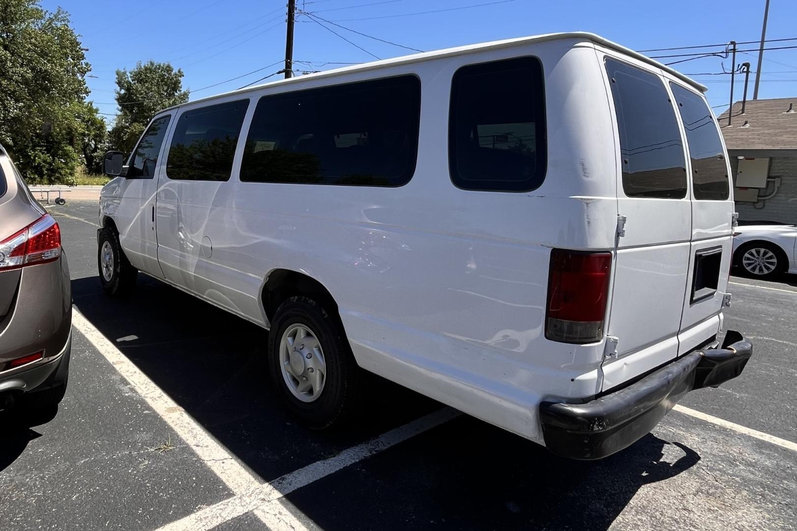 2012 white Ford E-Series Wagon (1FBSS3BL2CD) , located at 945 E. Jefferson Blvd, Dallas, TX, 75203, (214) 943-7777, 32.752514, -96.811630 - Photo#1